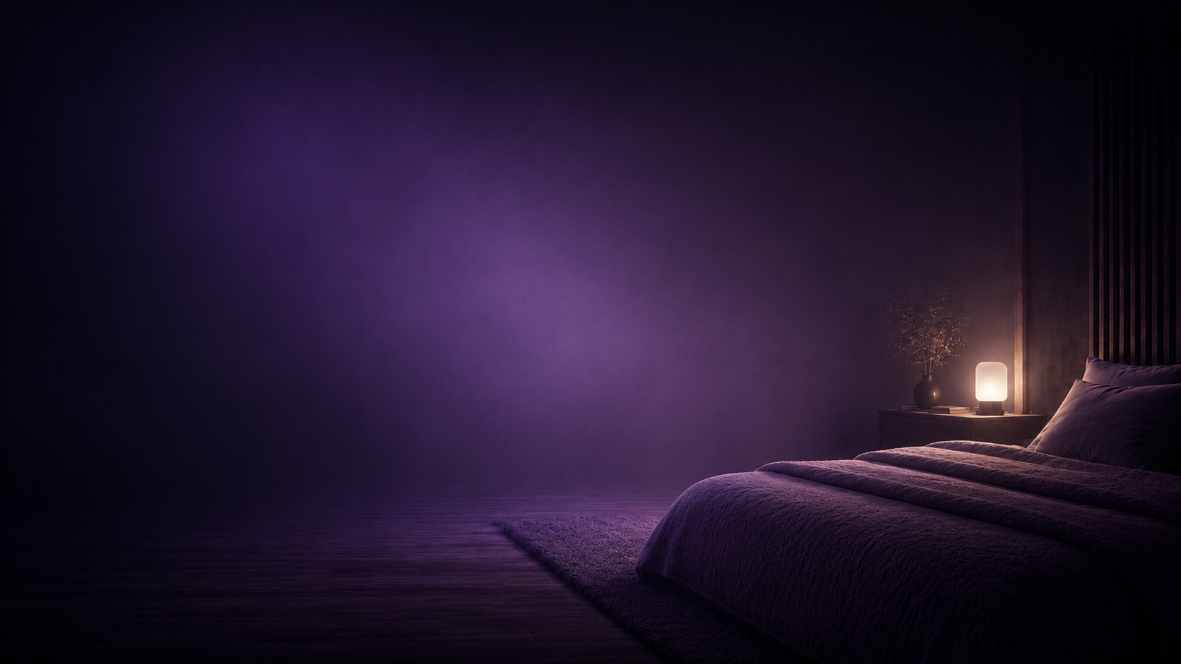 A calm dark bedroom lit by a single warm lamp, soft violet haze in the air